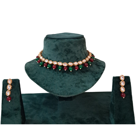 Single Line Oval Kundan Necklace Set with Red & Green Beads